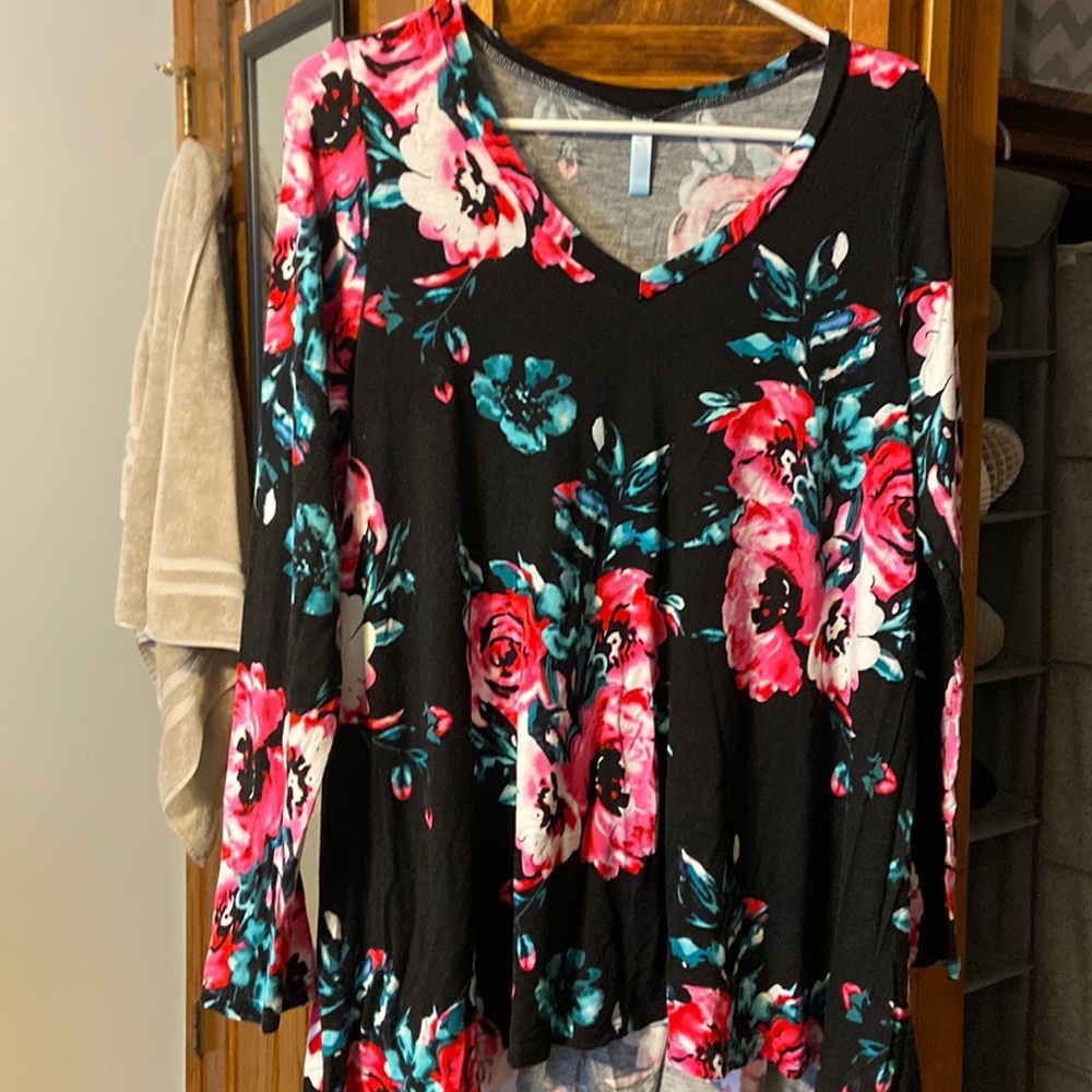 Black V-neck top with flowers.